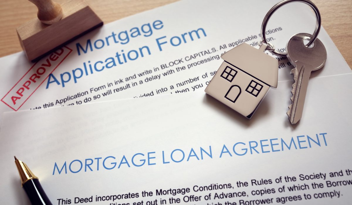 Mortgage application loan agreement and house key